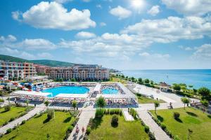 an aerial view of a resort with two pools and the ocean at Premier Fort Beach Sveti Vlas in Sveti Vlas