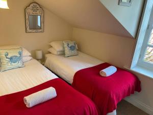 En eller flere senge i et værelse på Cobbly Cottage - North Creake + 5 billeder