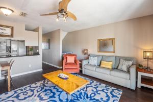 a living room with a couch and a table at Kate's Place - 13554 Perdido Key Drive in Pensacola