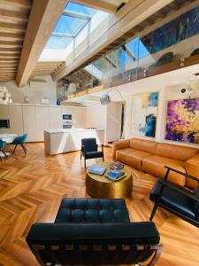 a living room with a couch and a table at La Limonaia della Torretta Luxury Private Pool in Florence
