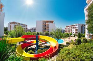 a water park with a colorful roller coaster at Golden Lady in Sveti Vlas