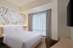 Postel nebo postele na pokoji v ubytování Fairfield by Marriott Bekasi