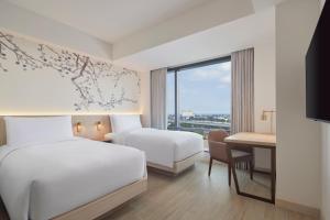Postel nebo postele na pokoji v ubytování Fairfield by Marriott Bekasi