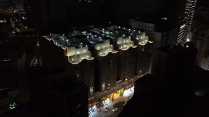 an overhead view of a city at night at Abraj Al Tayseer Tuwa Hotel in Makkah