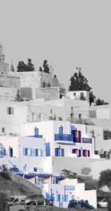 a group of buildings with blue and white at Asvestoti blue ciel light 2 in Pera Gyalos