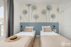 Ένα ή περισσότερα κρεβάτια σε δωμάτιο στο Seaside Apartamenty Wyspa Solna Kołobrzeg