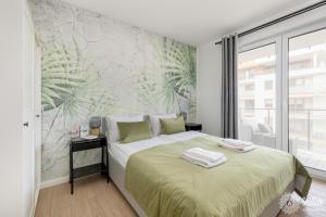 Ένα ή περισσότερα κρεβάτια σε δωμάτιο στο Seaside Apartamenty Wyspa Solna Kołobrzeg