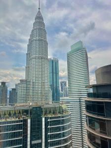 a group of tall buildings in a city at Sky Suites KL City Center in Kuala Lumpur