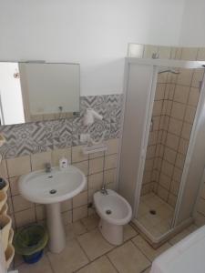 a bathroom with a sink and a toilet at Stellasalentina in Torre Colimena