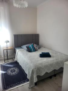 Posteľ alebo postele v izbe v ubytovaní Apartamenty Olimpijska