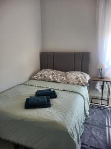 Posteľ alebo postele v izbe v ubytovaní Apartamenty Olimpijska