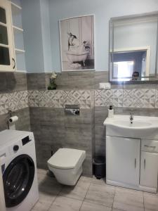 Kúpeľňa v ubytovaní Apartamenty Olimpijska