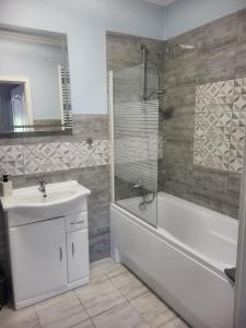 Kúpeľňa v ubytovaní Apartamenty Olimpijska