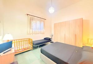 Ένα ή περισσότερα κρεβάτια σε δωμάτιο στο Argenteria Holiday Home
