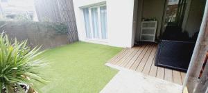Un jardín fuera de Appartement T2
