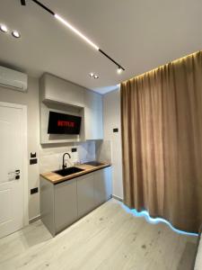 a kitchen with a sink and a counter top at EB apartment in (( Metoq ))