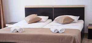Postel nebo postele na pokoji v ubytování Hotel Cosmos