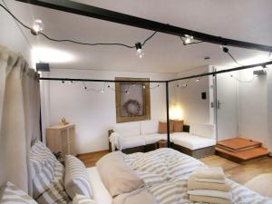 a room with a bed and a couch in it at La Maison Monsieur Mathieu in Rothenburg ob der Tauber