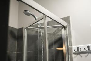 a shower in a bathroom with a glass door at Extended Stays Welcome - Sleeps 11 - FREE Parking - Hosted by HG Horizon Properties in Doncaster