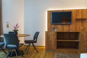 TV a/nebo společenská místnost v ubytování Stadthotel Pfeffermühle