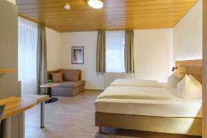 Postel nebo postele na pokoji v ubytování Stadthotel Pfeffermühle