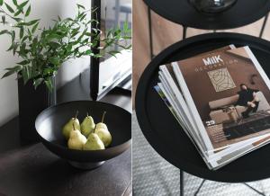 un tazón de peras en una mesa con un libro en Klimatyczny apartament 3-pokojowy, en Olsztyn