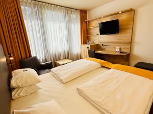 Postel nebo postele na pokoji v ubytování ARVENA Messe Hotel