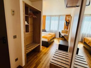 Postel nebo postele na pokoji v ubytování ARVENA Messe Hotel