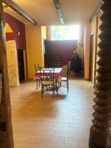 a dining room with a table and chairs at Etna Winery in Zafferana Etnea