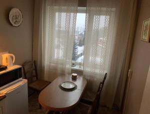 a dining room with a table and a window at Jalaka 2- bedroom apartment 4 beds free parking in Tartu +9 photos