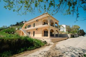 a house on the side of a dirt road at Giannis Holiday House 1 in Vitalades