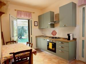 Kuchyň nebo kuchyňský kout v ubytování Agriturismo Peretti
