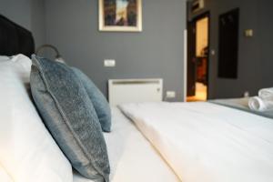 Postel nebo postele na pokoji v ubytování Hotel Dum by Muskat
