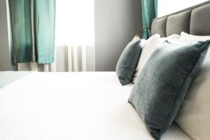 Postel nebo postele na pokoji v ubytování Hotel Dum by Muskat