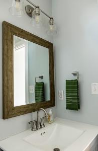 a bathroom with a sink and a mirror at Reynolds View in Asheville