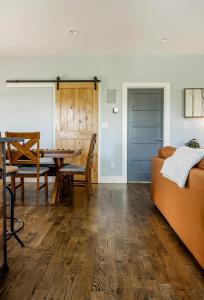 a living room with a table and a couch at Reynolds View in Asheville