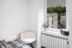 Ένα ή περισσότερα κρεβάτια σε δωμάτιο στο Modern & Bright 2BR Flat - Short Walk to Town