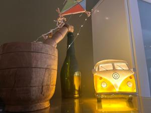 a table with a toy car and a bottle of wine at C' est la vie in Nafplio