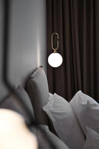 Postel nebo postele na pokoji v ubytování Asters Hotel