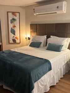 Ένα ή περισσότερα κρεβάτια σε δωμάτιο στο Flat 912 - Iate Plaza Hotel