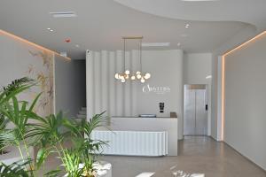 Postel nebo postele na pokoji v ubytování Asters Hotel