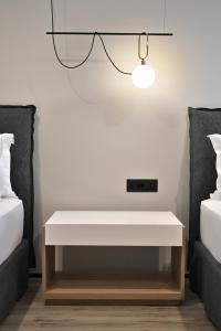 Postel nebo postele na pokoji v ubytování Asters Hotel
