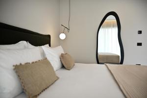 Postel nebo postele na pokoji v ubytování Asters Hotel + 37 fotografií
