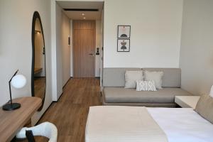 Postel nebo postele na pokoji v ubytování Asters Hotel