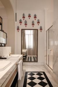 a bathroom with two sinks and a large mirror at Mazeej Balad - Boutique Hotel - Adult Only in Cairo +50 photos