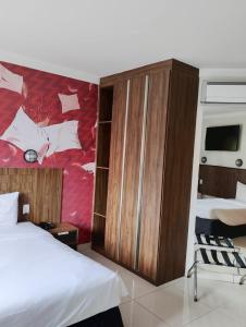 Postel nebo postele na pokoji v ubytování Hotel Cassino Tower Piracicaba by Nacional Inn