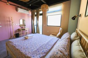 Letto o letti in una camera di 小島月光民宿 Moonlit Isle