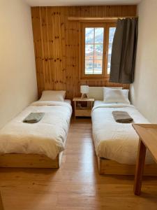 Postel nebo postele na pokoji v ubytování Grand appartement moderne et calme avec vue, balcon et parking couvert