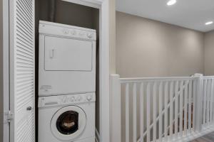 a washer and dryer in a baby room at Beach Baby by Gulf Coast Getaways in Navarre