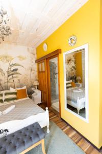 A bed or beds in a room at Vidéki Porta